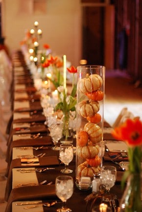 Thanksgiving table decor, pumpkins in glass vase