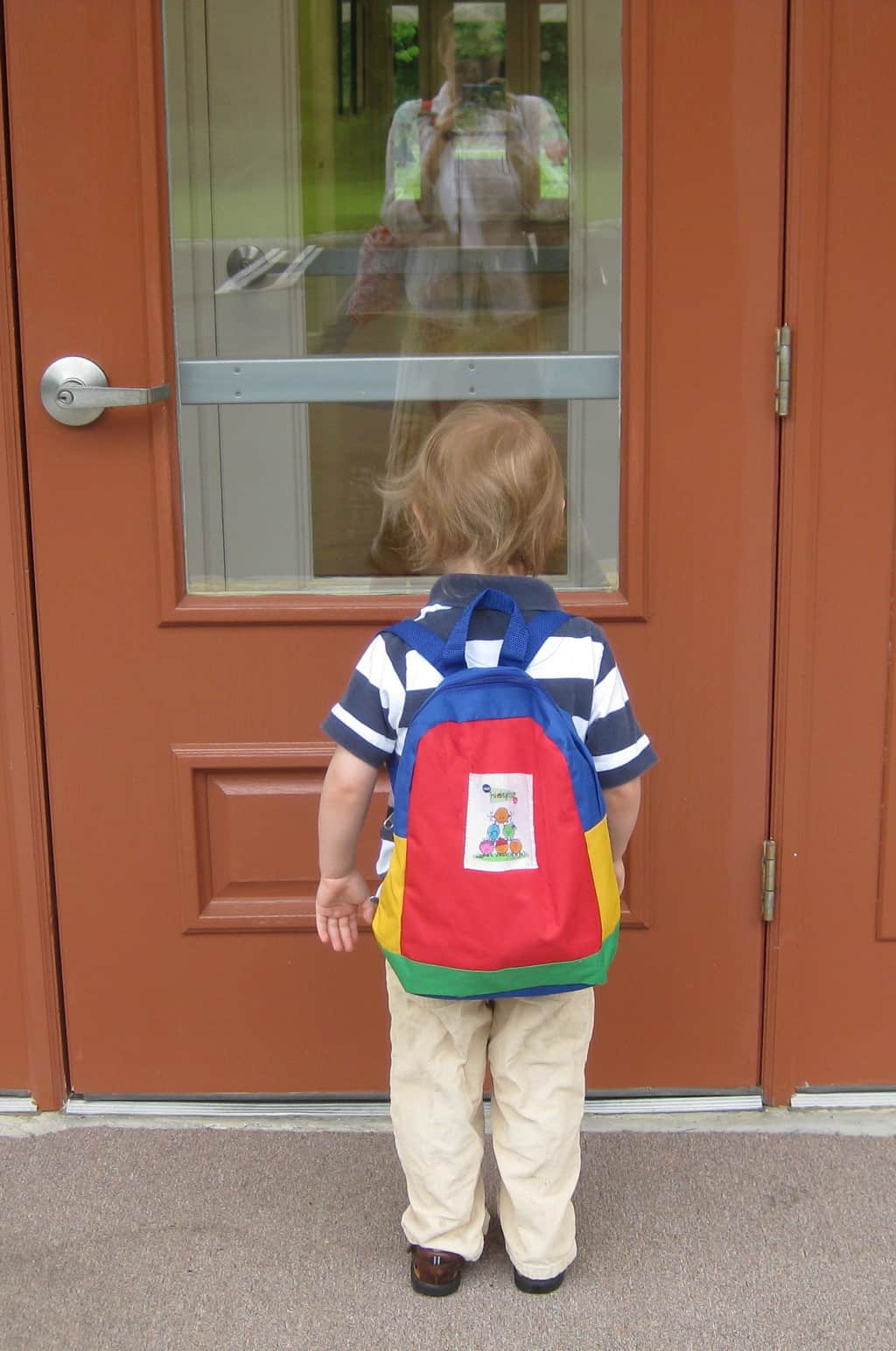 little boy getting ready for kindergarten