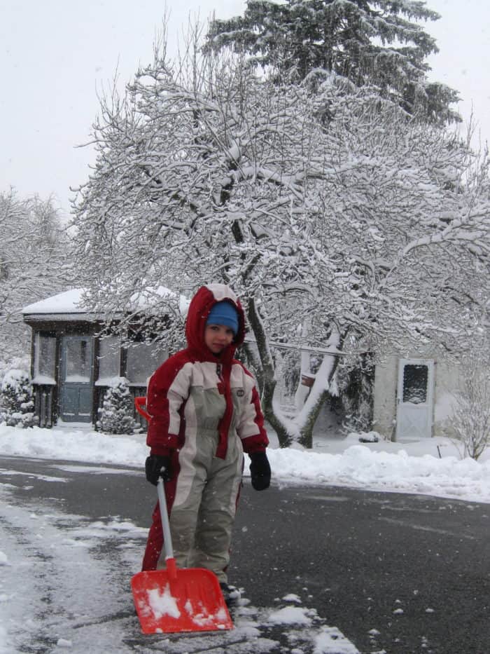 boy shoveling snow