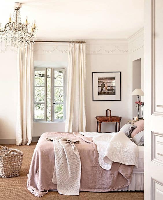 white romantic bedroom with chandelier
