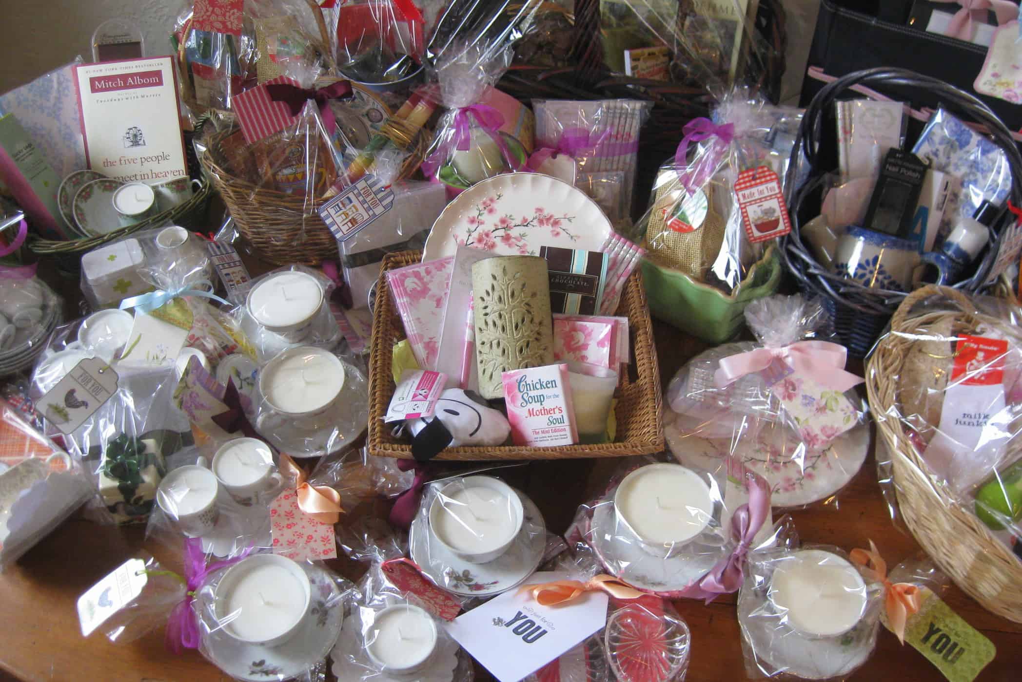 gift wrapped teacup candles and other gift baskets