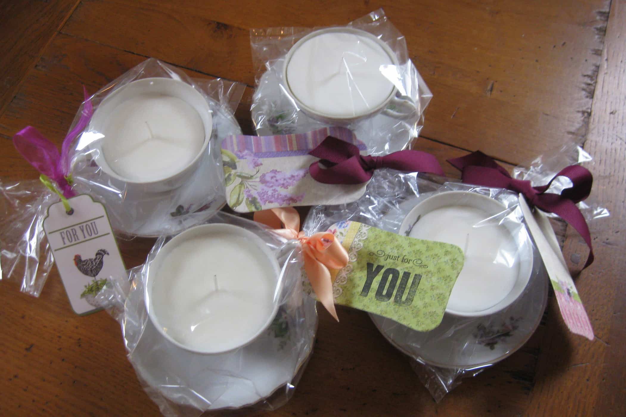 teacup candles in cellophane bags, gift wrapped with tags
