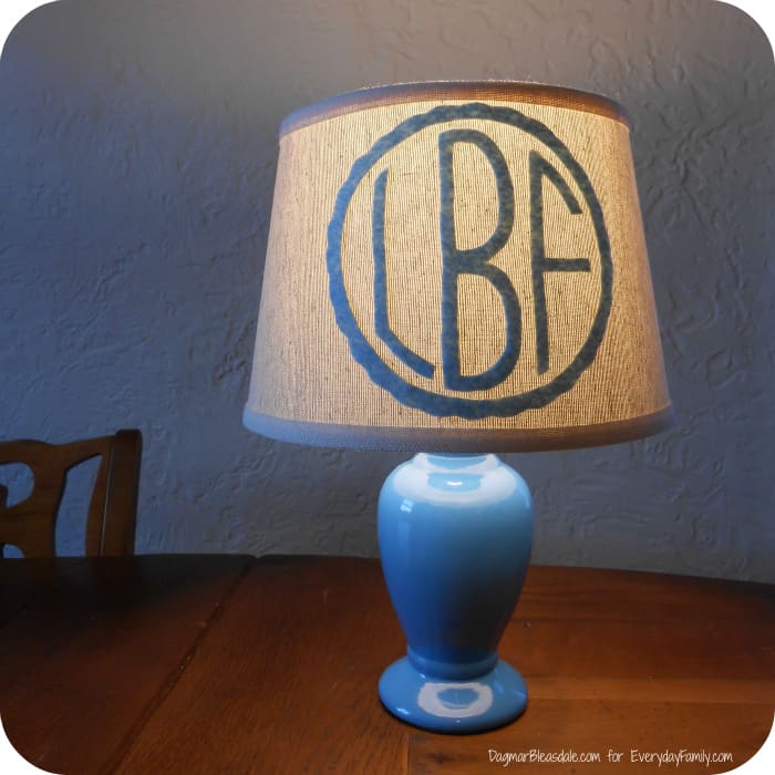 little lamp with monogram shade on table