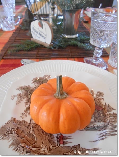 pumpkin on pretty plate and fall tablescape