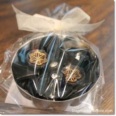 black vintage buttons in vintage Jello tin mold
