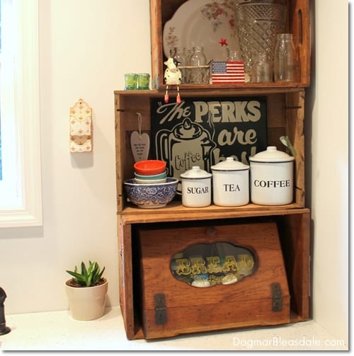 farmhouse kitchen with crate shelves on counter