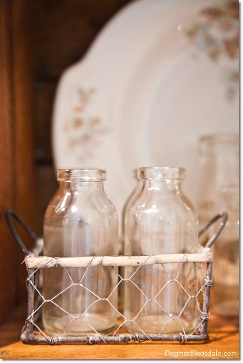 glass bottles in crate, vintage plate