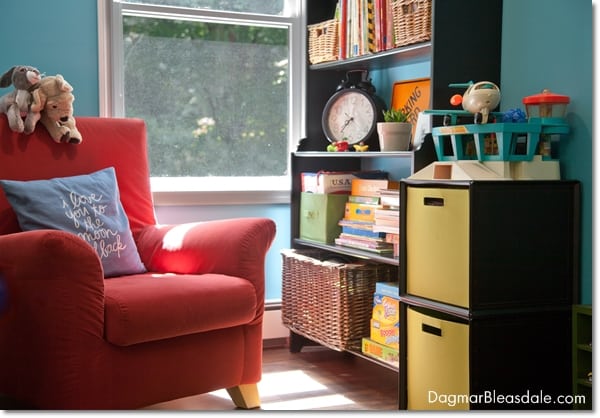 reading nook with big chair and bookshelf in kid's room
