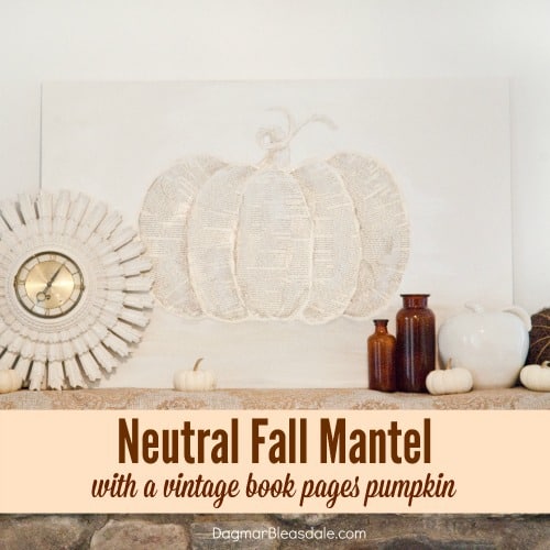 neutral fall mantel and book pages pumpkin