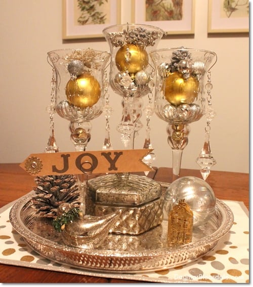 New Year's Eve decor with glasses, ornaments, and silver tray