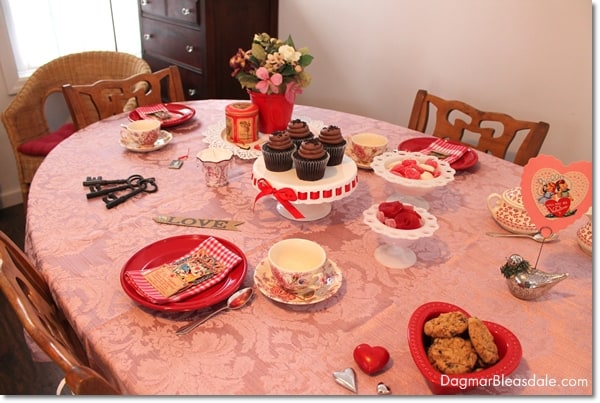 Valentine's Day tablescape with pink tablecloth and red plates