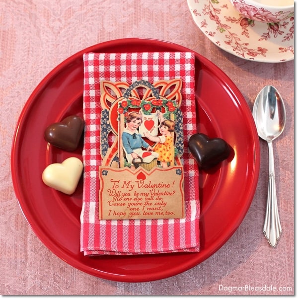 Valentine's Day table setting with vintage Valentine's cards