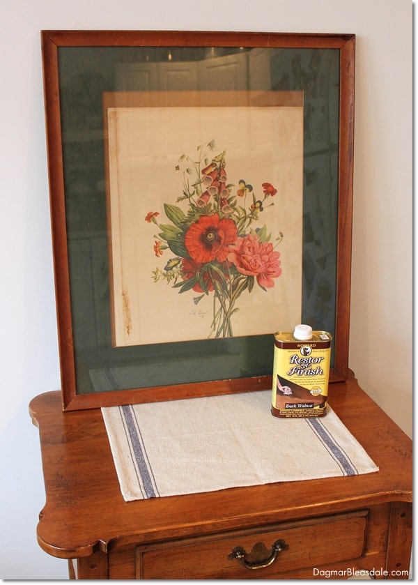 framed print on side table with can of Howard's Restor-A-Finish