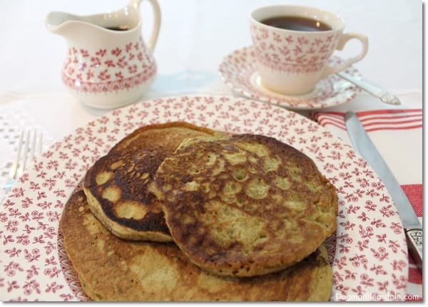 pancakes on vintage plate, coffee cup and creamer