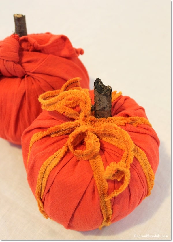 toilet paper roll pumpkins wrapped in orange fabric