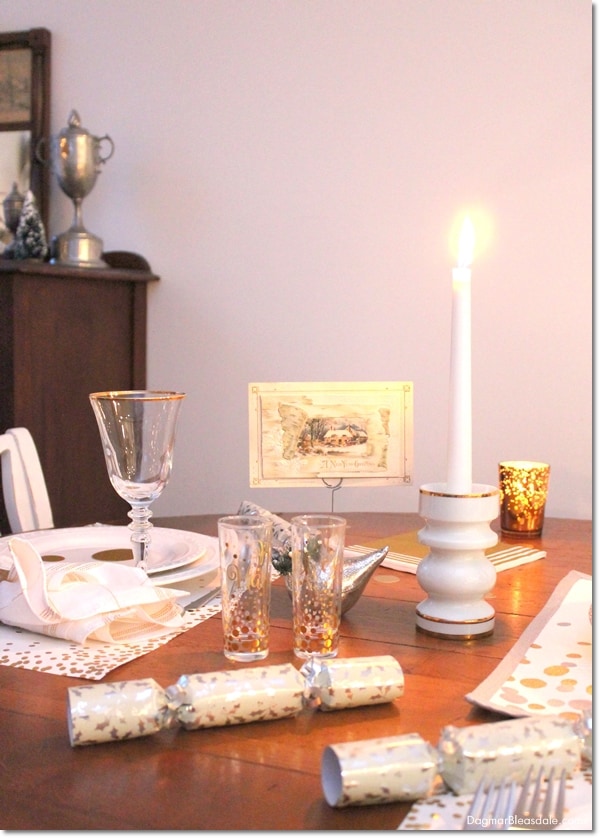 New Year's Eve Party decor with silver and gold dots and candle