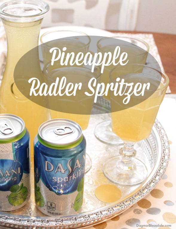 glass bottle and glasses with Pineapple Spritzer drink