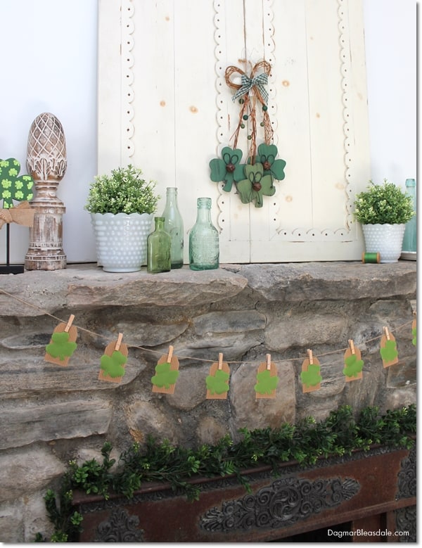 St. Patrick's Day banner and other decor on mantel