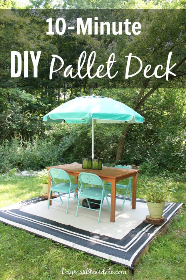 pallet deck made with 4 pallets, with table and chairs and umbrelle