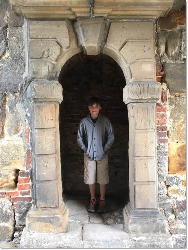 boy in doorway in castle