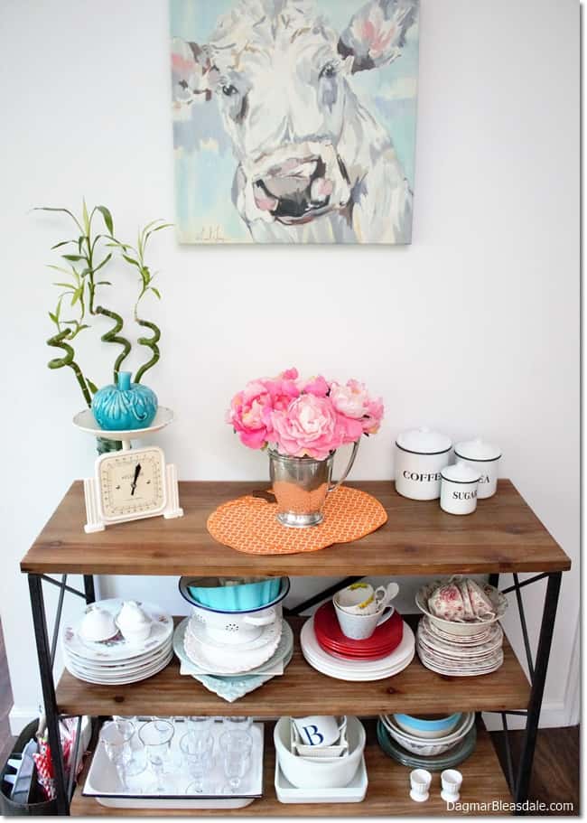 shelf with dishes and fall decor, cow painting
