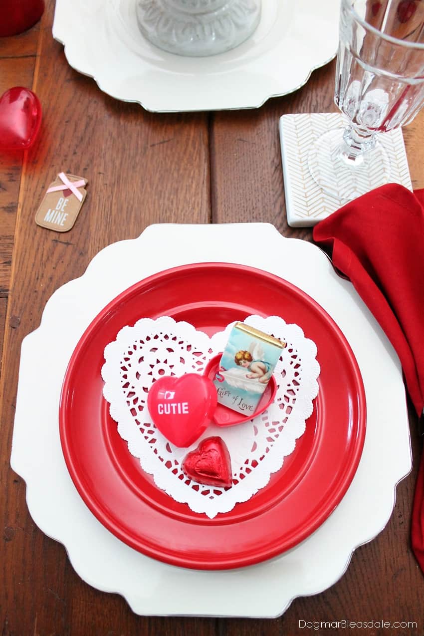 Valentine’s Day Table decor, red plate, white charger, heart chocolate