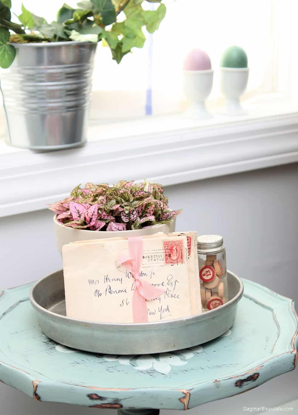 vintage letters and plant on tray, Easter eggs on windowsill 