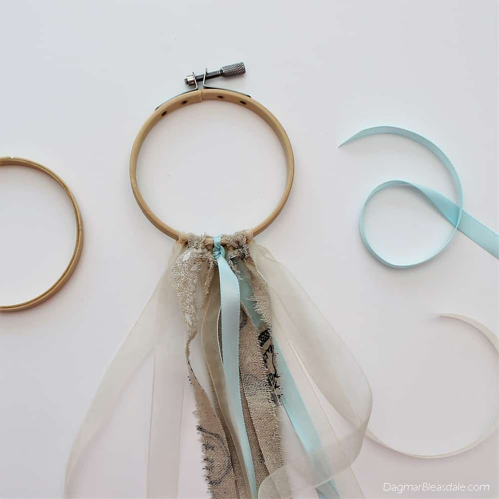 DIY dreamcatcher with ribbon, doily, and embroidery hoop