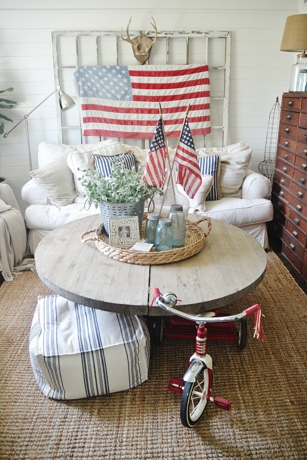 sofa and coffee table, vintage flag and flags in bottles