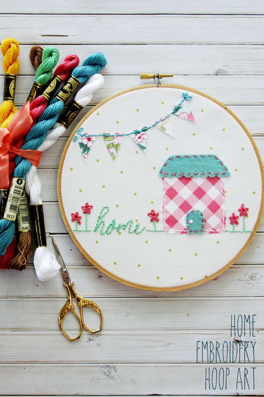 embroidery hoop and yarn on white table