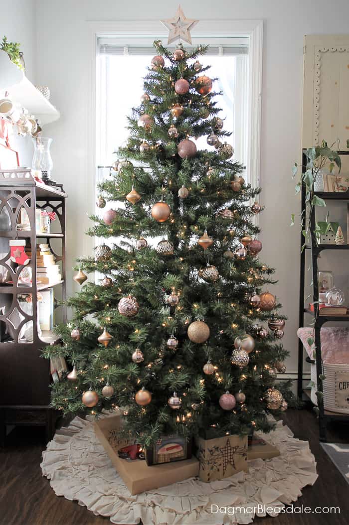 living room with Christmas tree with blush ornaments