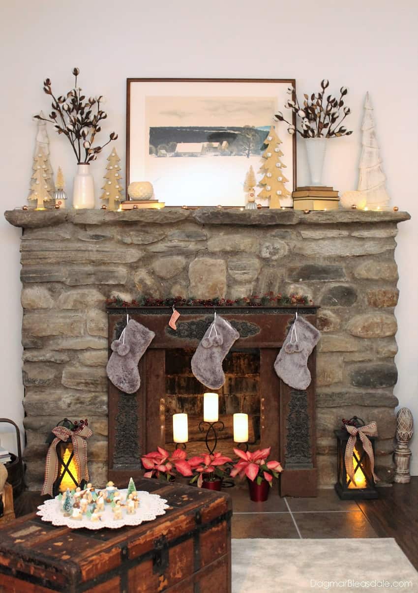 stone fireplace with neutral Christmas decor