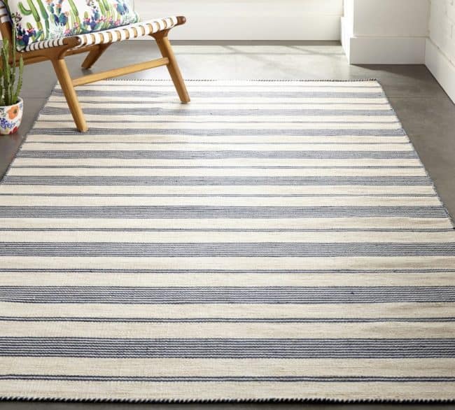 white and blue stripe rug and chair