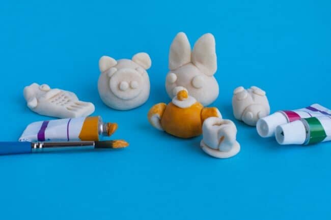 DIY salt clay figurines salt dough clay figurines and paint on table