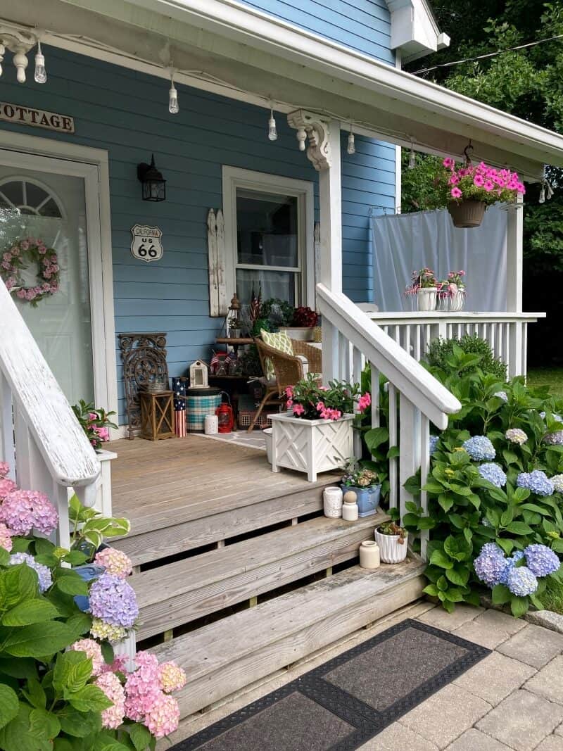 porch with farmhouse decor and outdoor rug