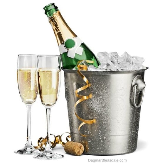 champagne bottle in ice bucket and two glasses