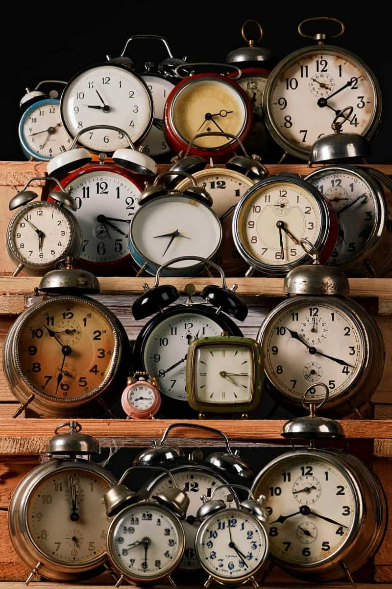 clock collection on shelves